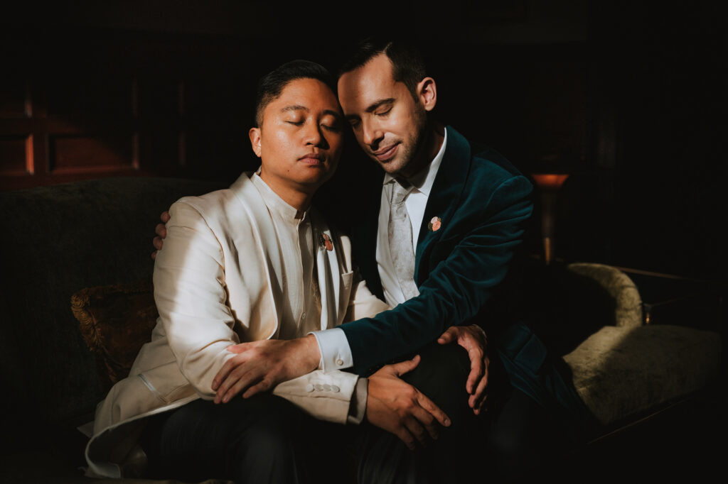 gay grooms embrace on their wedding day